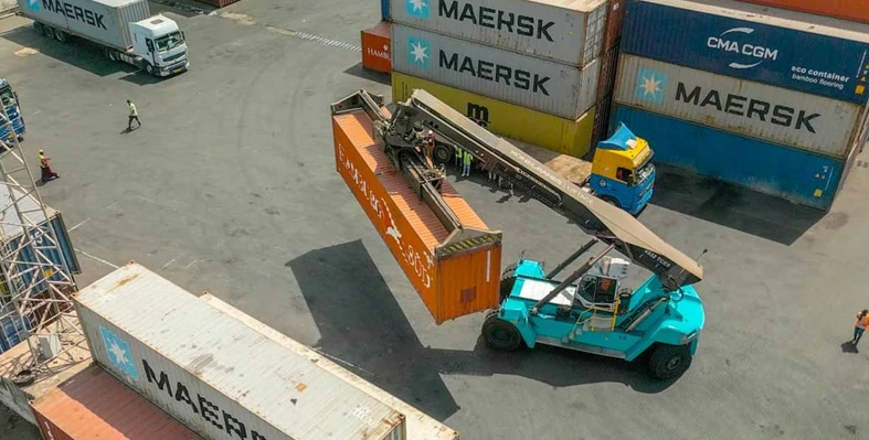 The project will extend and modernise the Moroni and Boingoma ports. (Image source: AfDB) An overhead shot of containers being moved at a port facility.