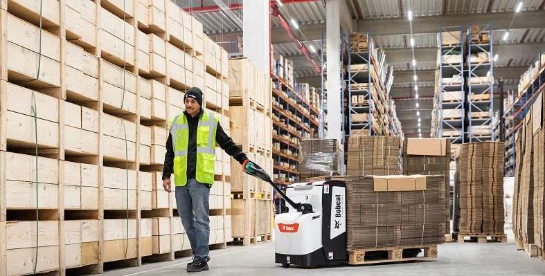 Bobcat can now offer its customers an even more complete package of material handling solutions. (Image source: Bobcat) Bobcat machinery in action on a warehouse floor.