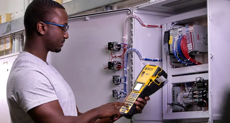 Brady Corporation empowers panel builders with durable, compliant, and efficient labelling systems for electrical clarity. (Image source: Brady Corporation) Man_with_the_labeling_machine